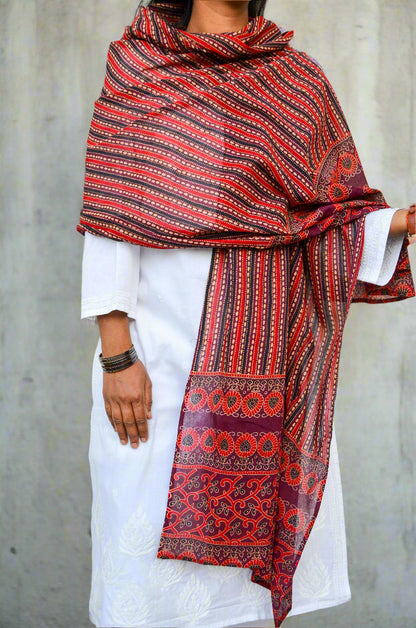 Elegant Ajrakh hand block printed dupatta in red with intricate patterns, perfect for traditional attire