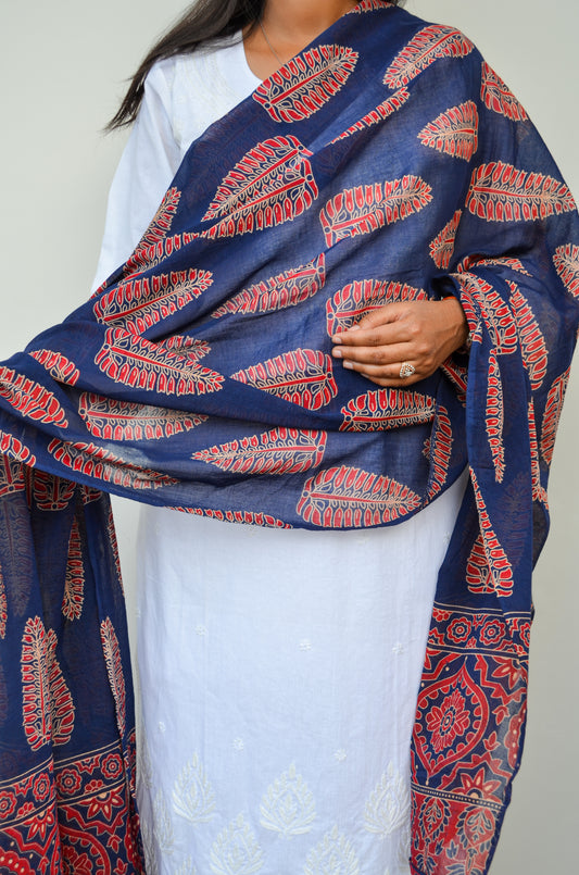 Women wearing Ajrakh hand block printed cotton dupatta in navy blue with intricate red patterns