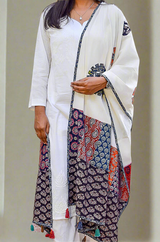 Elegant Ajrakh hand block printed dupatta featuring vibrant patterns and tassels for stylish women