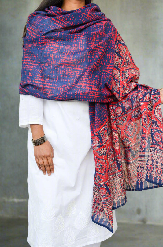 Ajrakh hand block printed dupatta in blue and red, draped elegantly over a white outfit