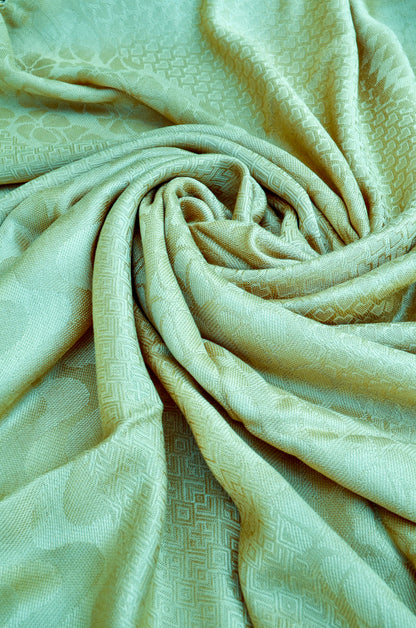 Soft beige jacquard stole with intricate patterns, perfect for stylish layering and comfort
