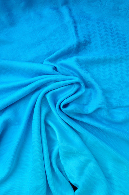 Soft blue gradient jacquard stole with intricate textured pattern for stylish layering