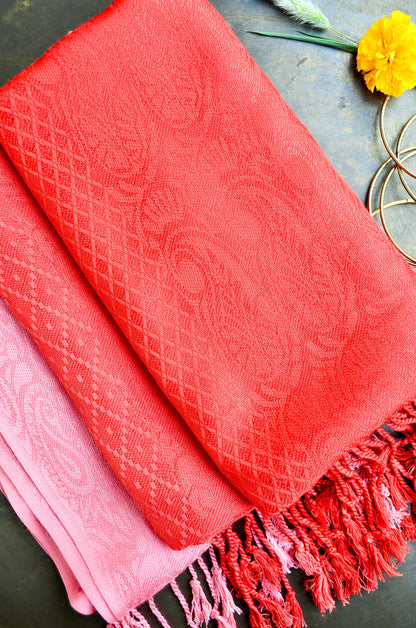 Crimson jacquard stole by Pinaachi featuring intricate texture and stylish fringes