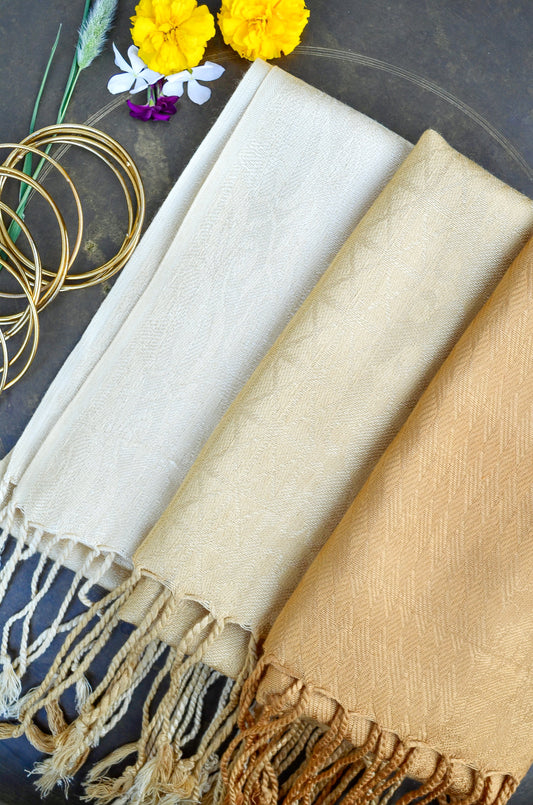 Pinaachi golden jacquard stole in three elegant colors with fringed edges and floral decorations