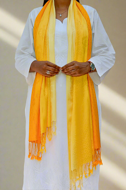 Elegant golden yellow jacquard stole draped on a model's shoulders for a chic look