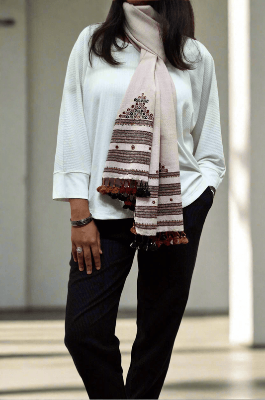 Elegant hand woven merino wool stole with intricate embroidery and tassels, perfect for stylish layering