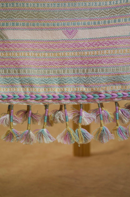 Handwoven merino wool silk shawl featuring colorful tassels and intricate patterns