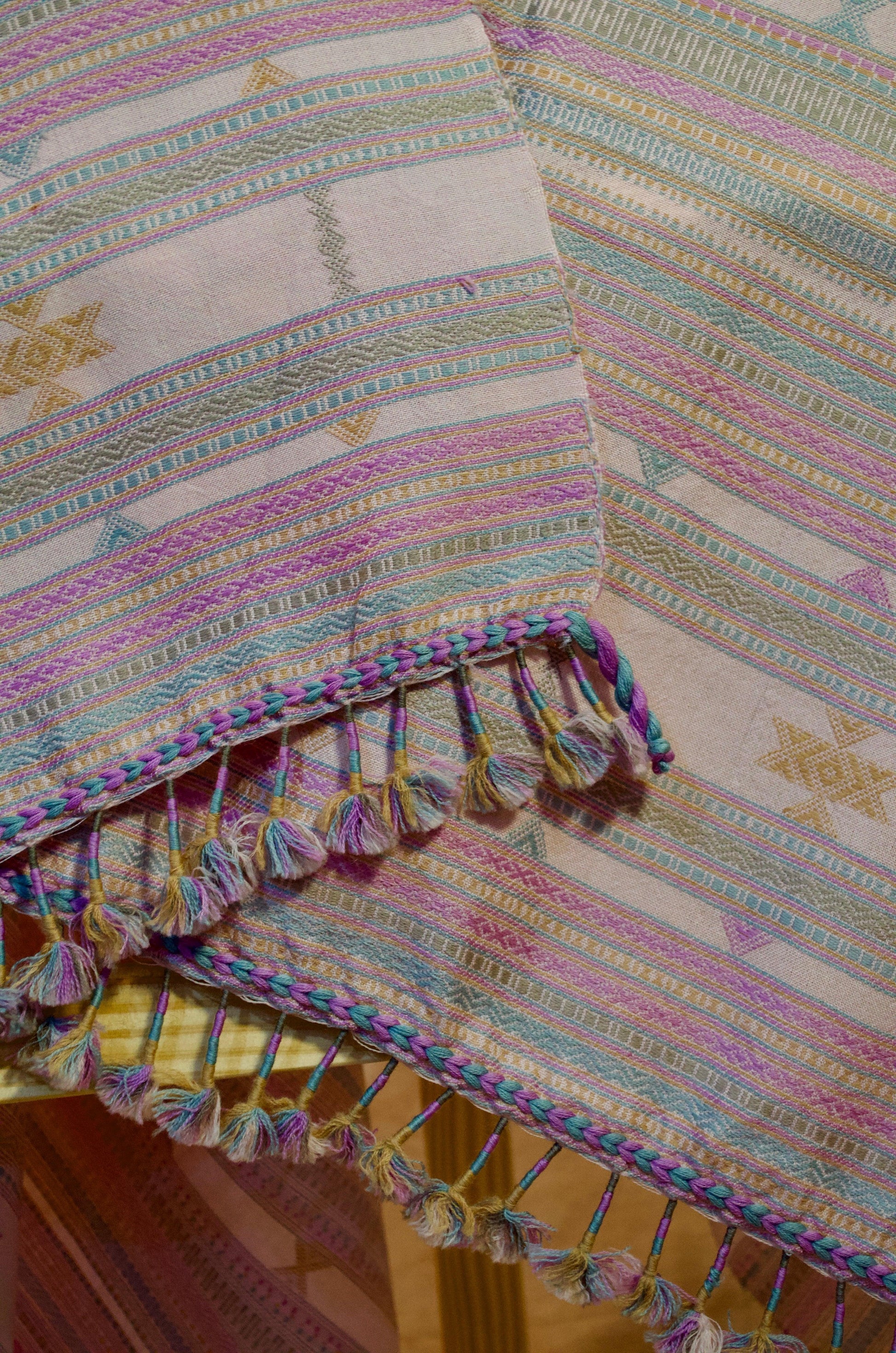 Elegant handwoven merino wool silk shawl with colorful patterns and decorative tassels