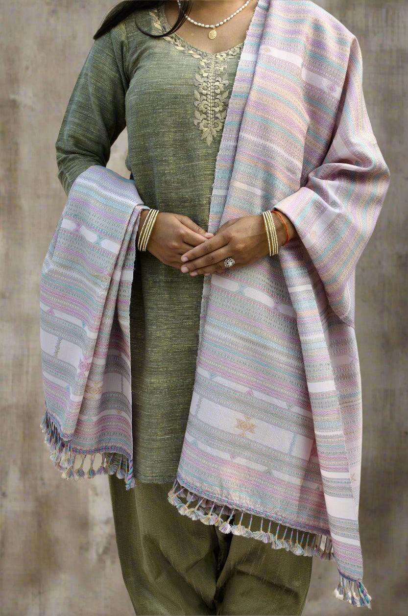 Elegant handwoven merino wool silk shawl draped over a traditional outfit with intricate details