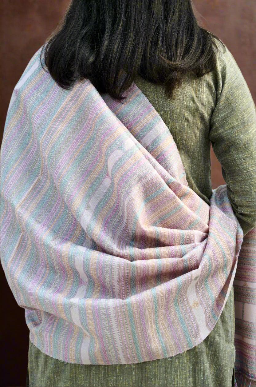 Elegant handwoven merino wool silk shawl in pastel stripes draped over a model's shoulder