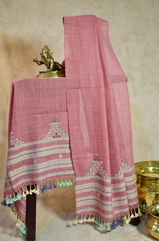Handwoven merino wool stole with intricate embroidery and colorful tassels for elegant styling