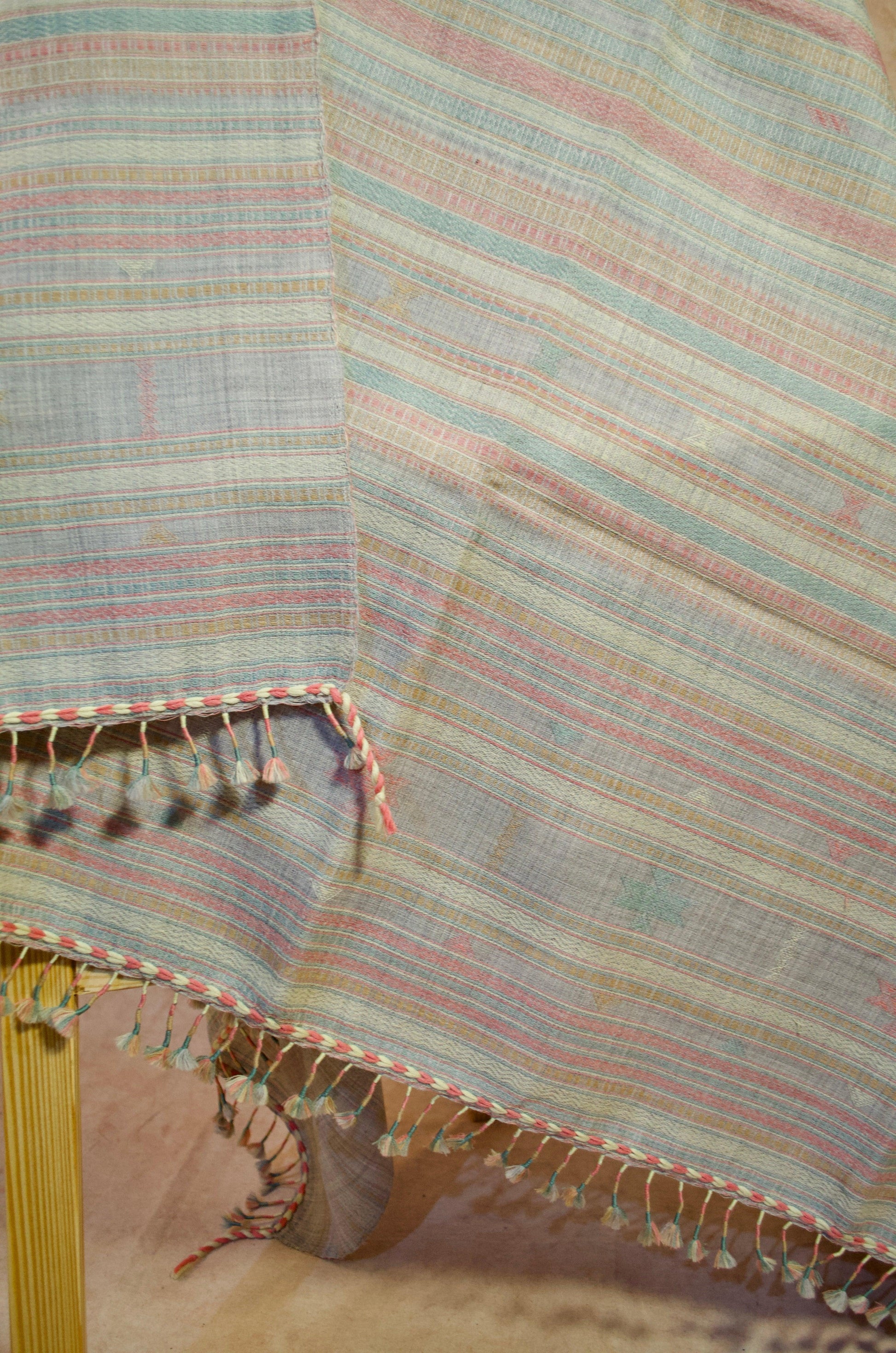 Kutchhi traditional shawl with vibrant stripes and decorative fringes for elegant layering