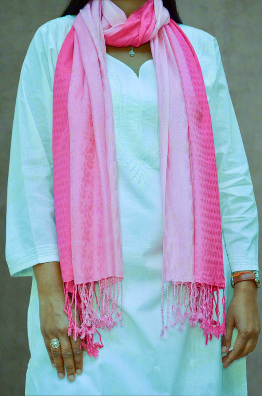 Light pink gradient jacquard stole draped elegantly over a white outfit for a stylish look