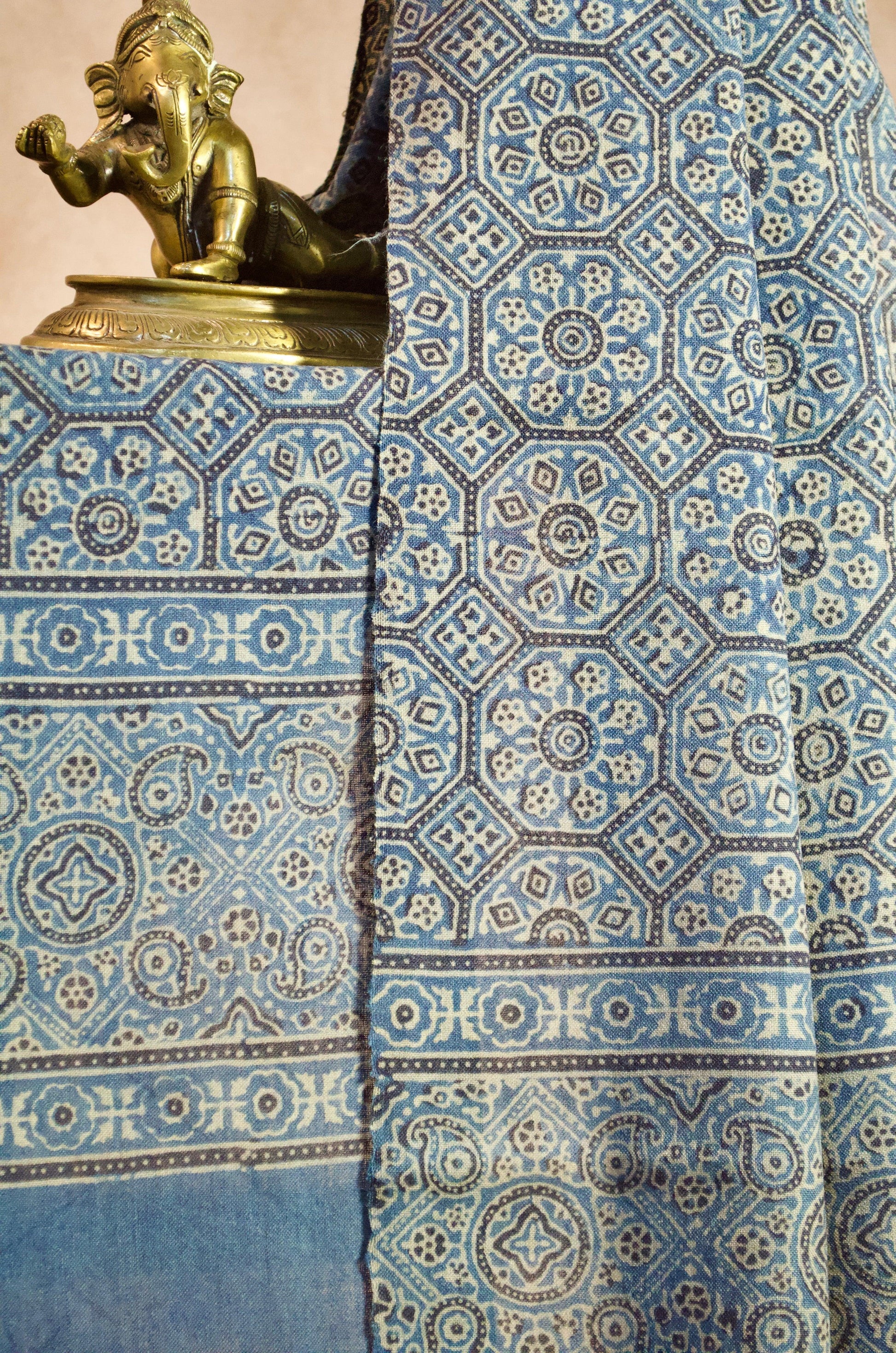 Elegantly designed Merino wool Ajrakh stole featuring traditional patterns in vibrant blue.