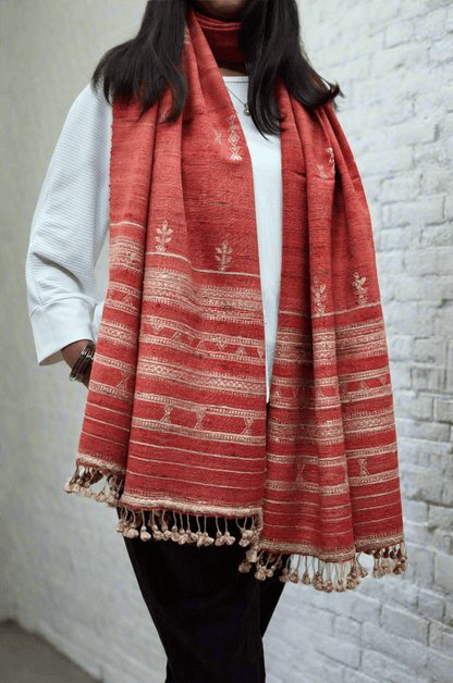 Elegant Merino wool Tasar silk stole with intricate patterns and tassel detailing, perfect for stylish layering