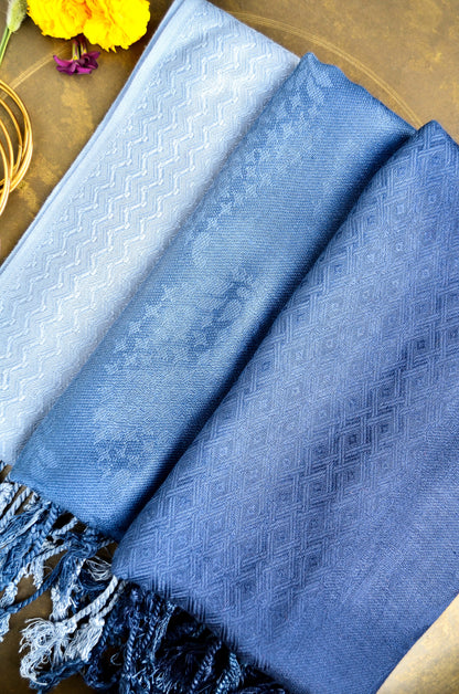 Elegant midnight blue jacquard stole with intricate patterns and fringed edges, perfect for stylish layering