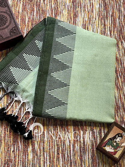 Sage green cotton saree by Pinaachi with traditional patterns and tassels for elegant styling