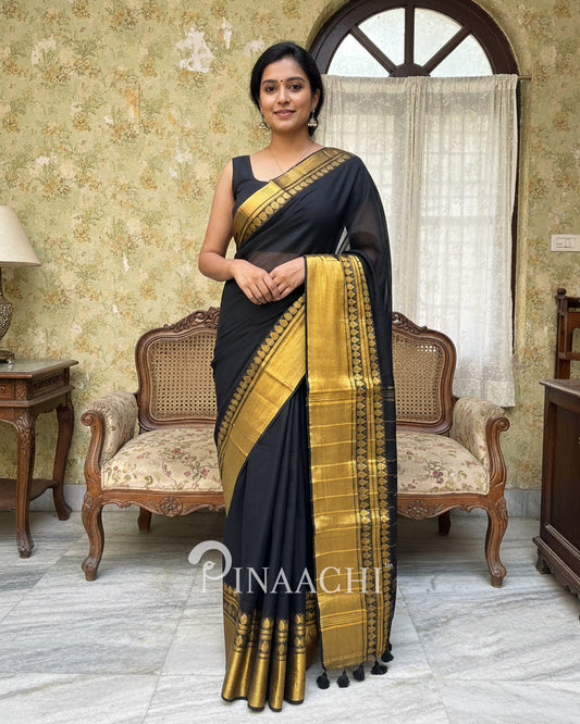 Pinaachi black cotton saree with gold border and elegant design, perfect for festive occasions