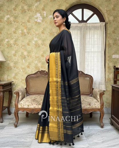 Pinaachi black cotton saree with golden border, perfect for traditional occasions