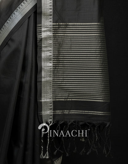 Elegant black mul tissue handloom saree with intricate silver border and fringed pallu