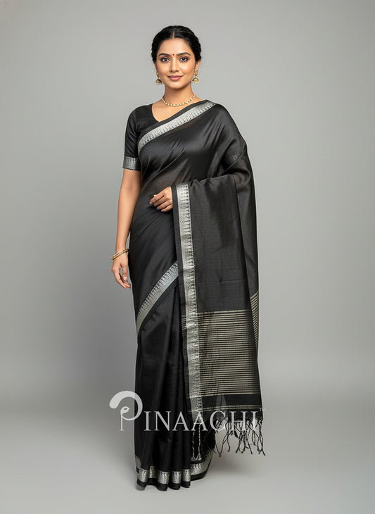 Elegant black mul tissue handloom saree by Pinaachi featuring silver detailing and a sophisticated drape