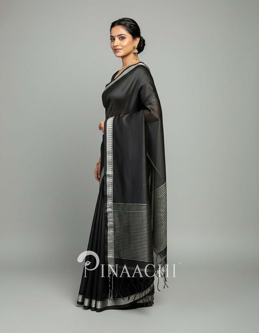 Elegant black mul tissue handloom saree from Pinaachi with silver border and draping design