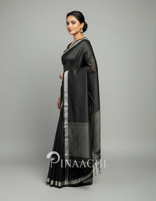 Elegant black mul tissue handloom saree from Pinaachi with silver border and draping design