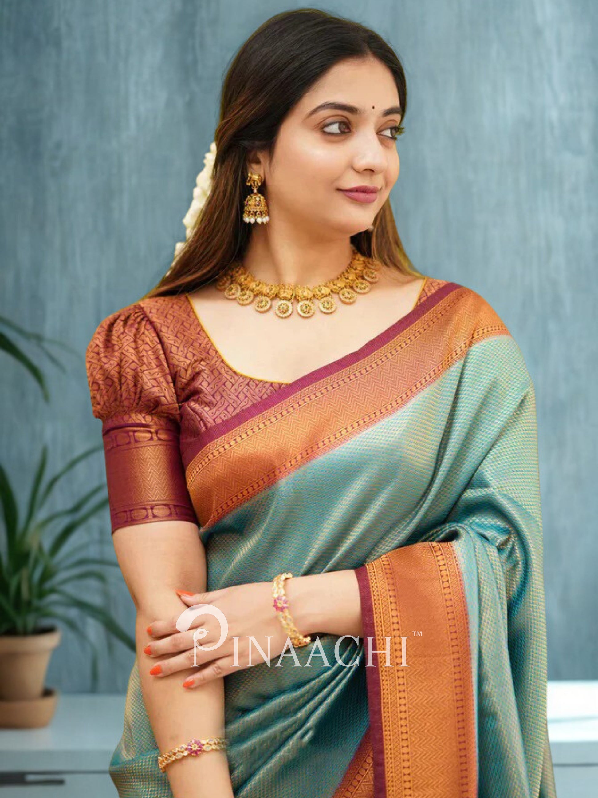 Elegant blue maroon licchi silk saree designed by Pinaachi, perfect for festive occasions.