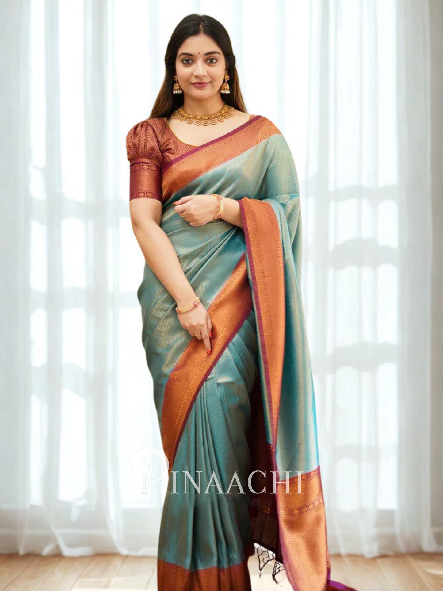 Elegant blue maroon licchi silk saree from Pinaachi with a stylish blouse and traditional drape