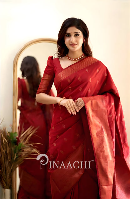 Pinaachi Cherry Red Litchi Silk Saree showcased on a model with elegant draping and subtle patterns