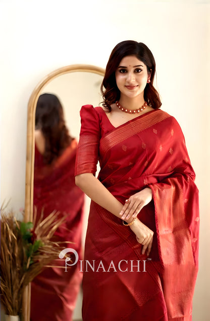 Pinaachi Cherry Red Litchi Silk Saree featuring elegant design and rich texture on a model