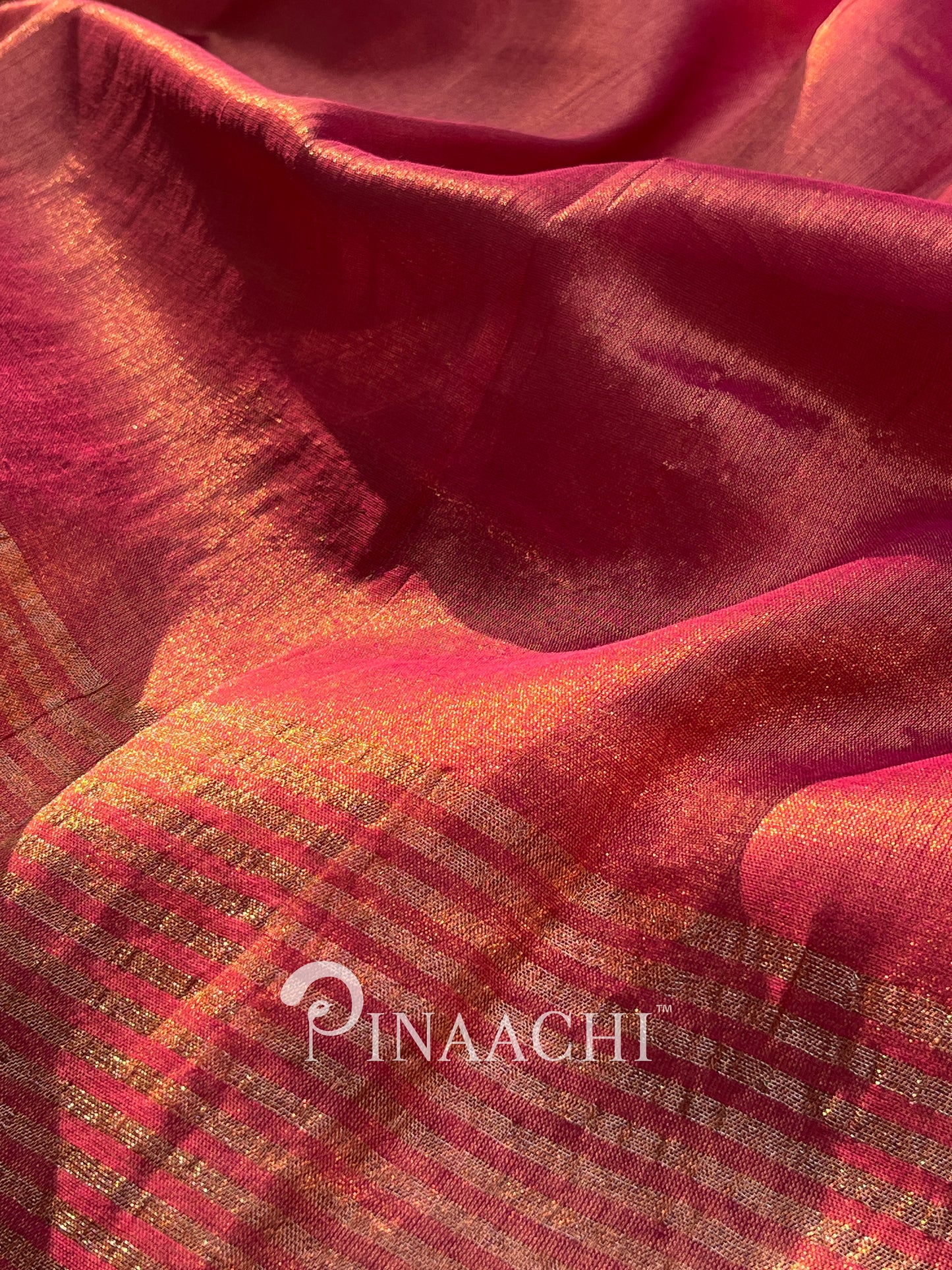 Elegant coral blush mul tissue saree by Pinaachi with a shimmering finish