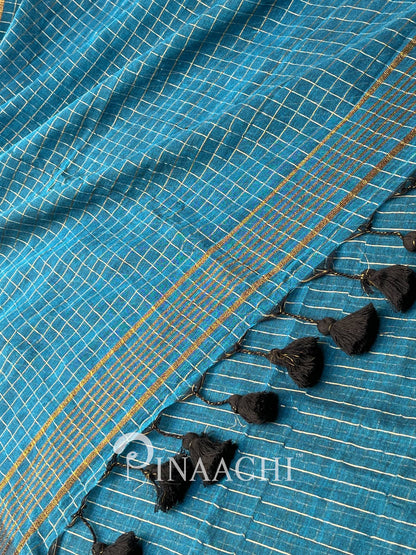Pinaachi deep blue checked mulmul saree with decorative tassels along the edge