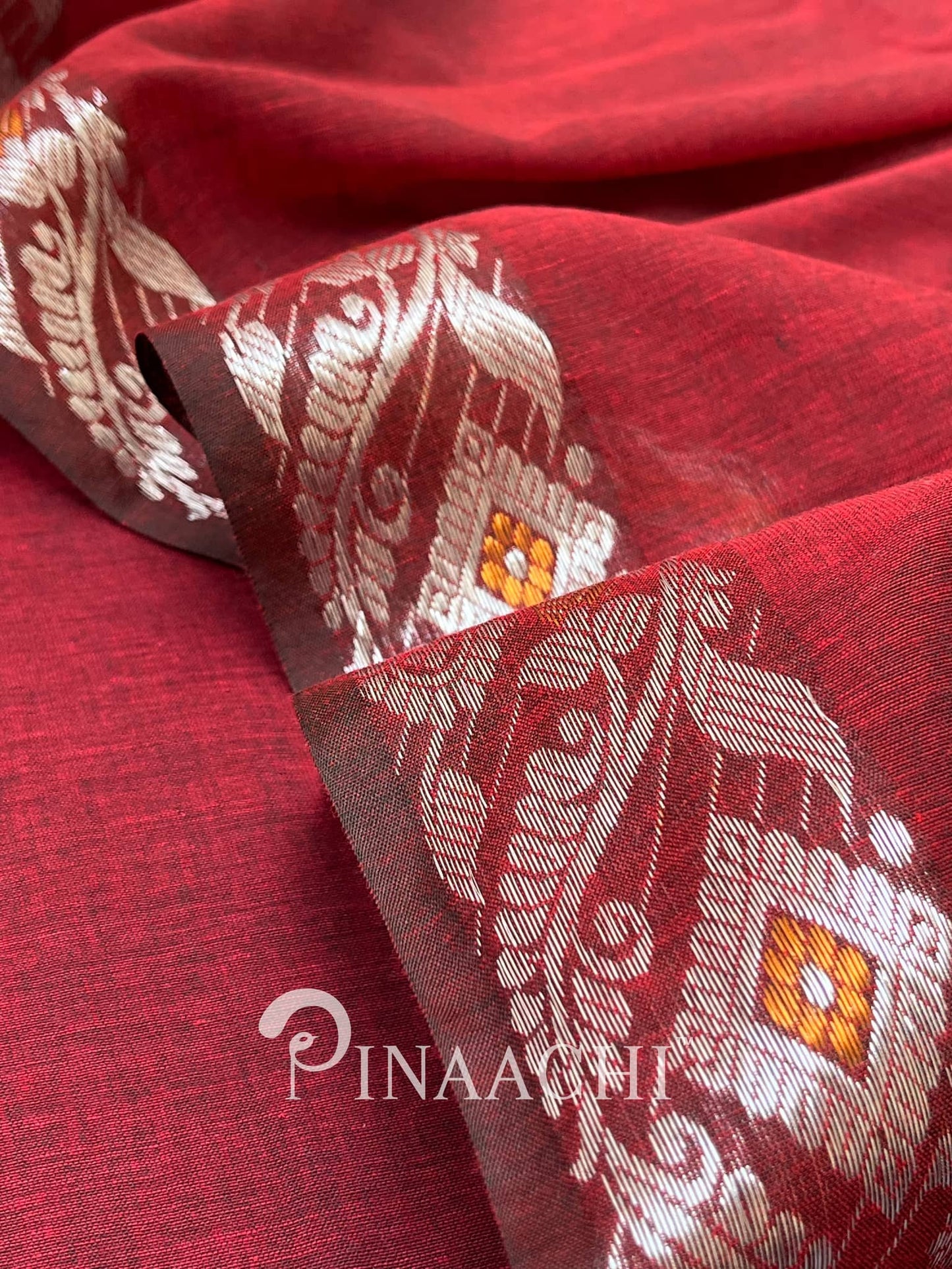 Pinaachi deep red handloom mulmul saree with intricate floral designs in golden thread