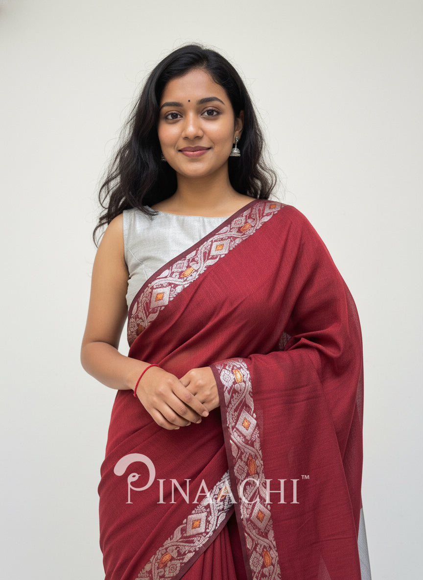 Pinaachi deep red handloom mulmul saree with elegant weaving details for festive occasions