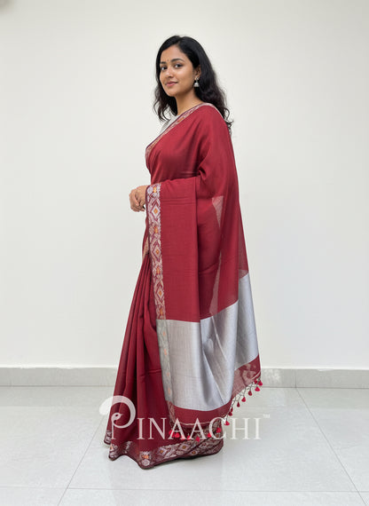 Pinaachi deep red handloom mulmul saree with elegant silver border for festive occasions