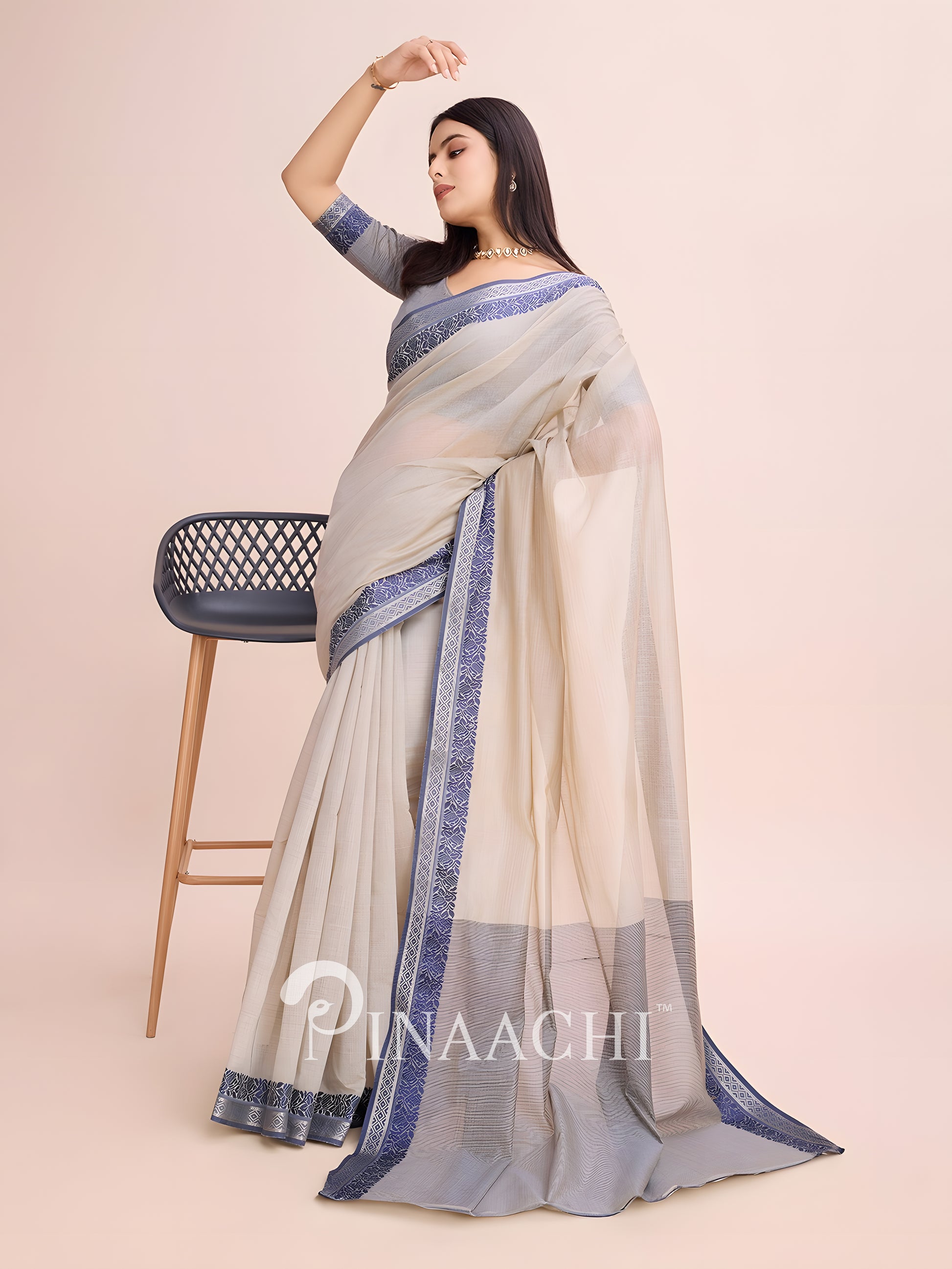 Pinaachi dove grey cotton saree with elegant border, styled for a graceful look