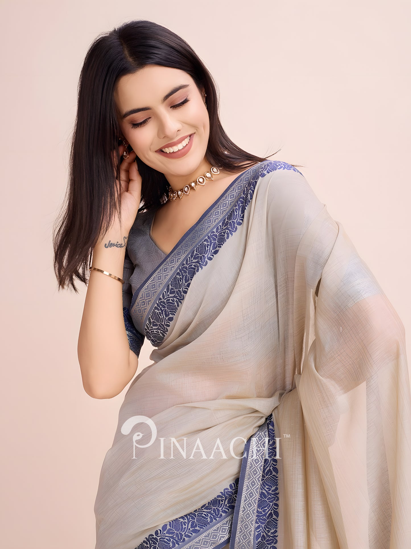 Elegant dove grey cotton saree by Pinaachi with intricate blue border design