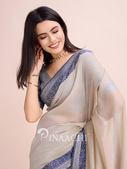 Elegant dove grey cotton saree by Pinaachi with intricate blue border design