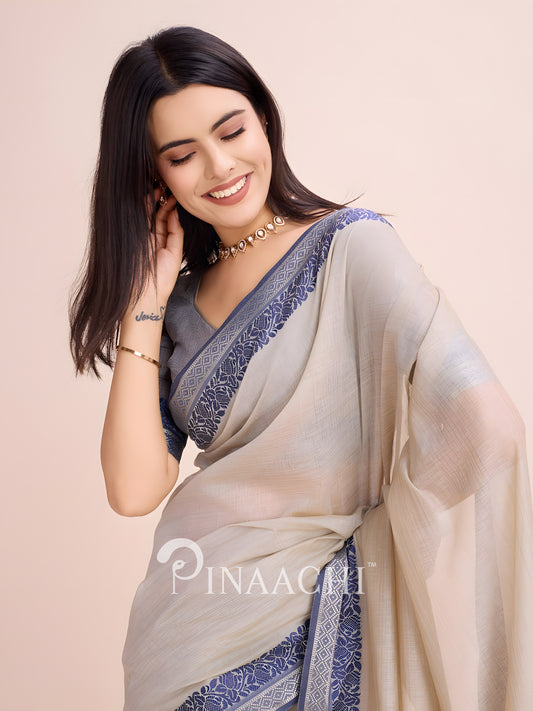 Elegant dove grey cotton saree by Pinaachi with intricate blue border design