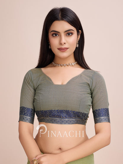 Pinaachi green cotton saree with woven border featuring a stylish blouse and elegant design