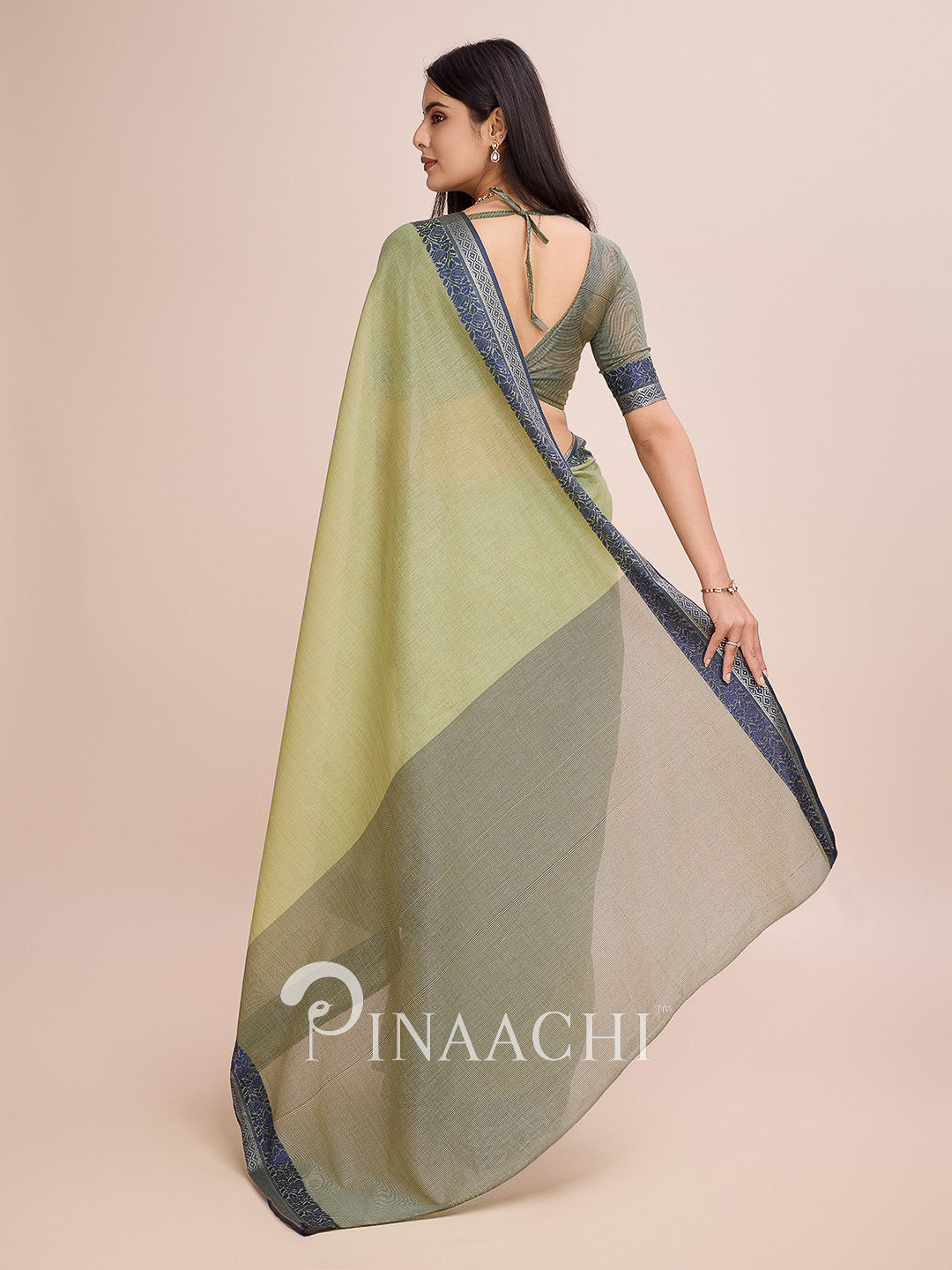 Pinaachi green cotton saree with woven border featuring an elegant drape and back design