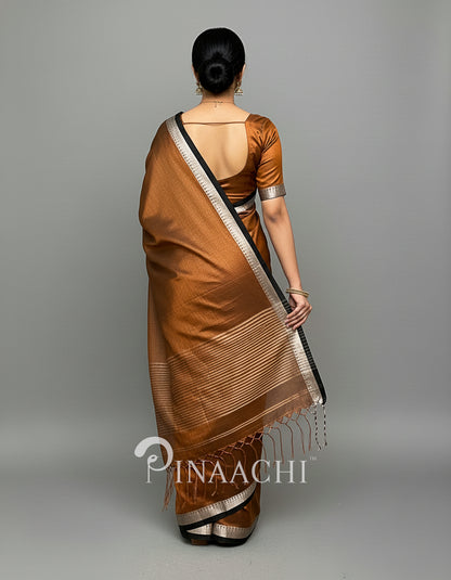 Elegant handloom coffee tissue saree by Pinaachi with sophisticated draping and contrasting borders