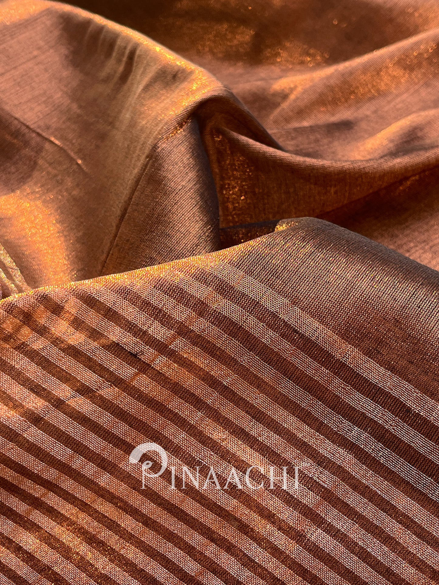 Handloom coffee tissue saree by Pinaachi with intricate woven patterns in rich brown tones