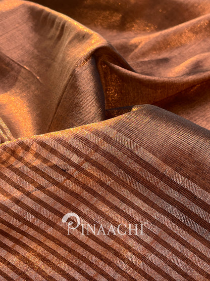 Handloom coffee tissue saree by Pinaachi with intricate woven patterns in rich brown tones