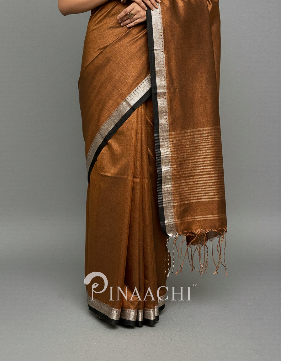 Elegant handloom coffee tissue saree with a silver border from Pinaachi for special occasions