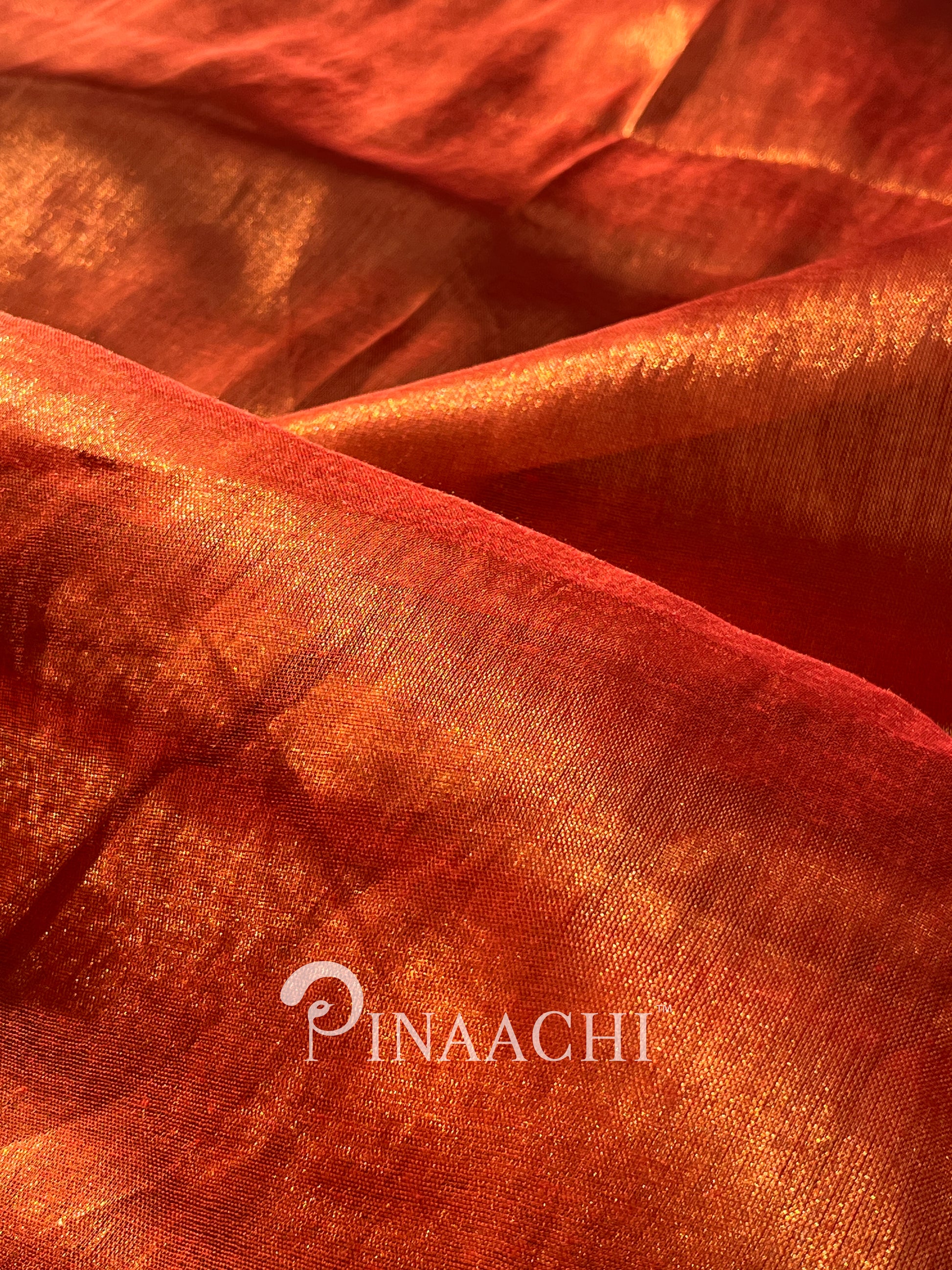 Handloom copper tissue silk saree by Pinaachi with rich, shimmering textures and vibrant colors