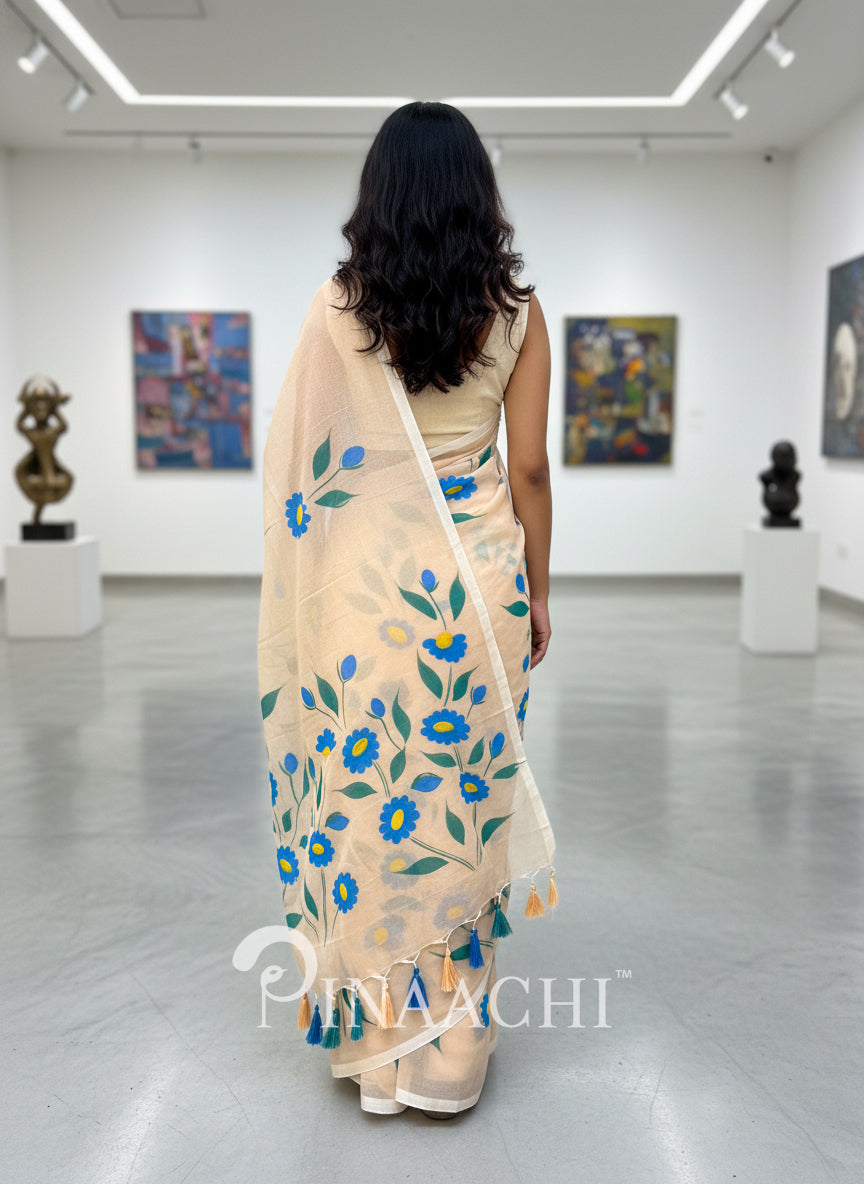 Pinaachi handloom handpainted mulmul saree in cream with colorful floral designs for elegant occasions