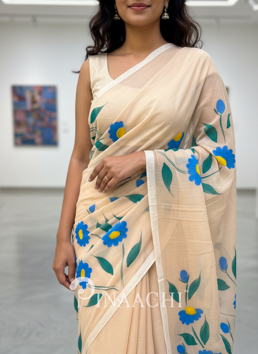 Pinaachi beige handloom handpainted mulmul saree with floral blue motifs for elegant styling