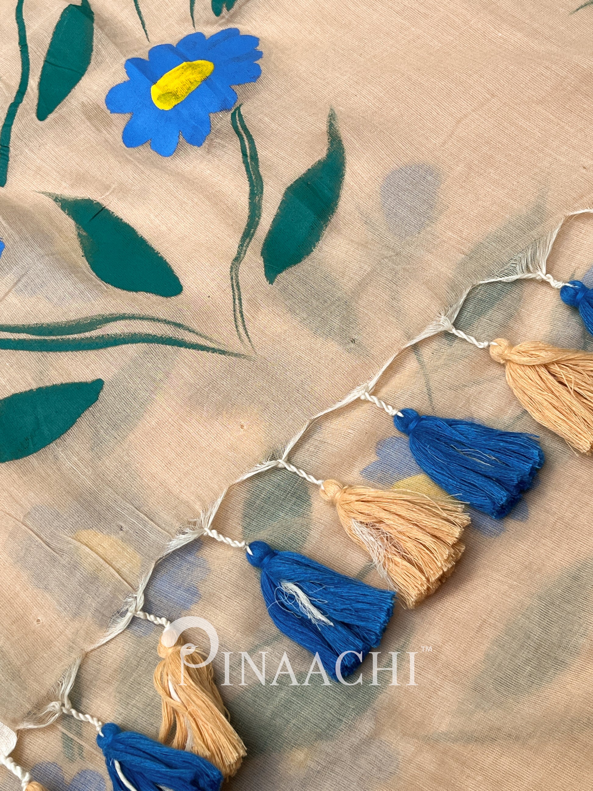 Pinaachi handloom handpainted mulmul saree with floral design and colorful tassel detailing
